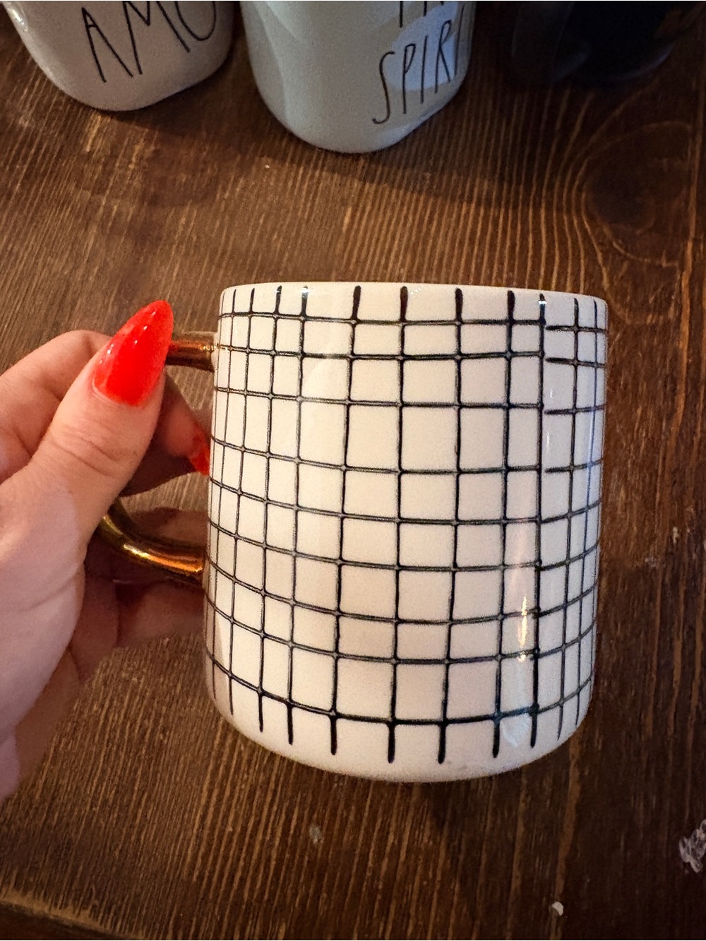 White Ceramic Mug with Black Grid Pattern and Gold Handle